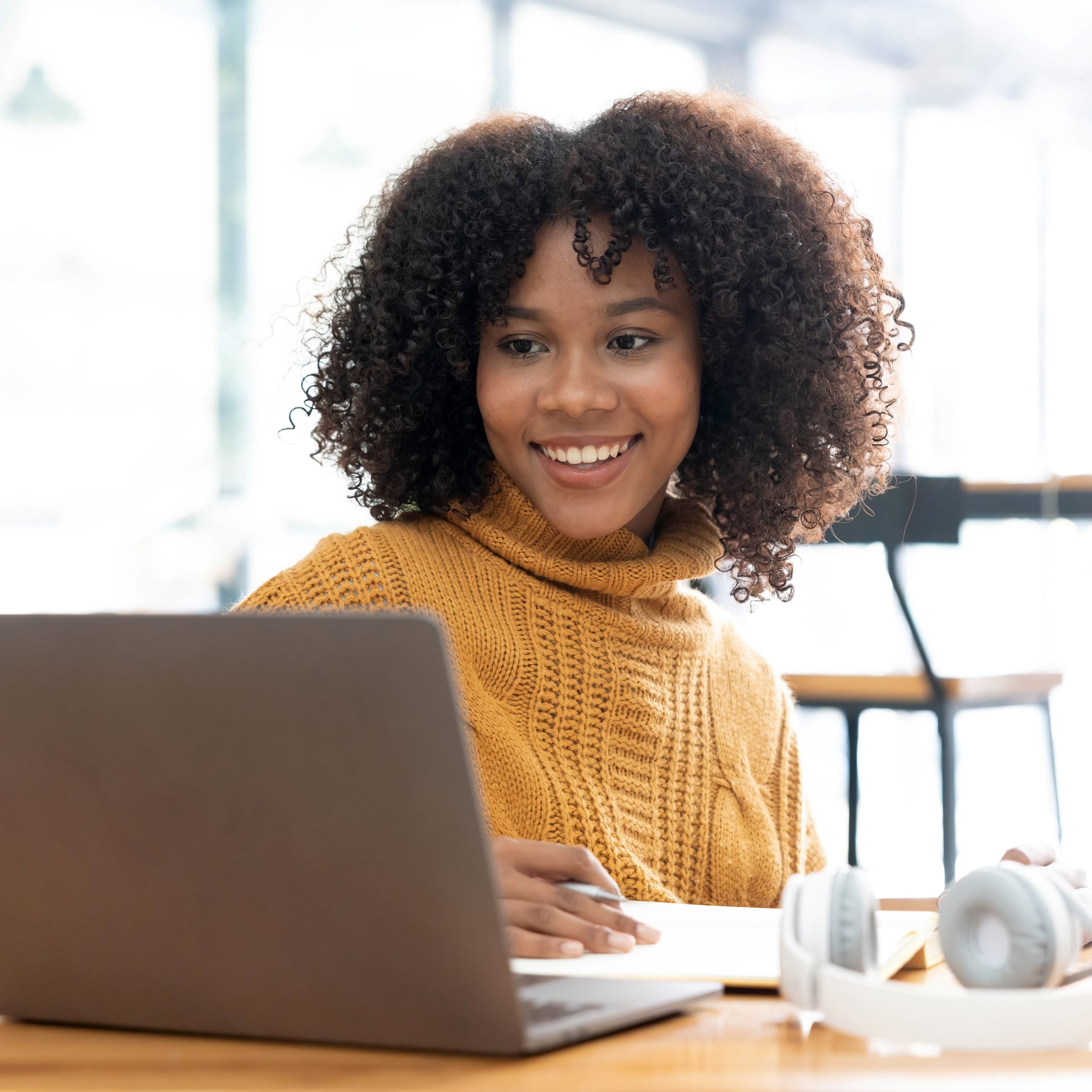 A Kansas woman searching on her laptop "How Does the Abortion Pill Work?"