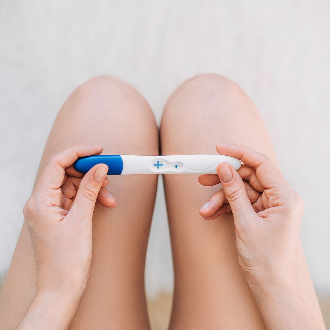 Free Pregnancy Tests A woman holding a free pregnancy test in Liberal, Kansas