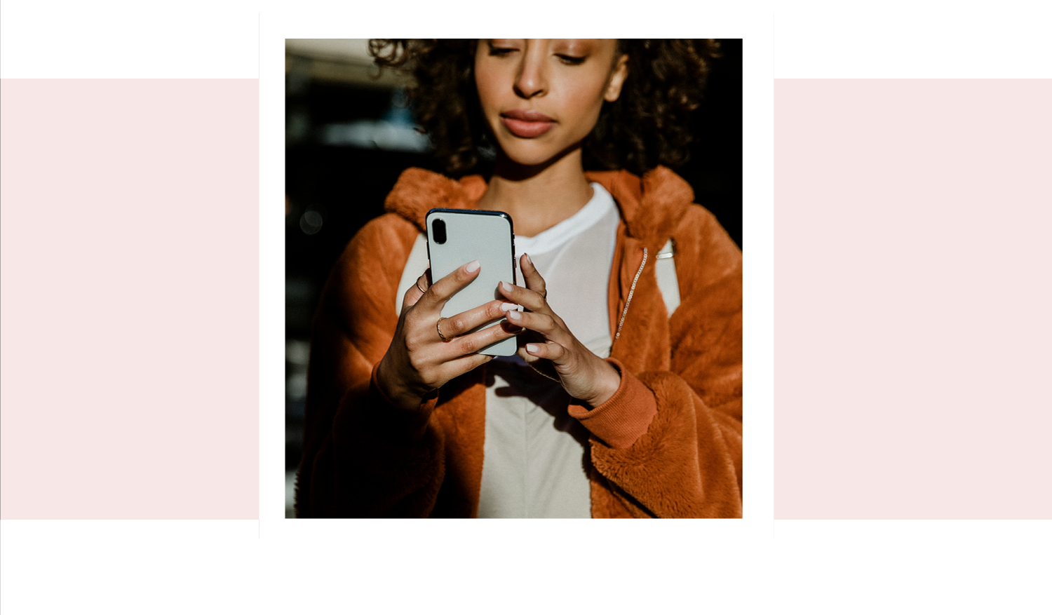 A woman searching on her phone for pregnancy support in Liberal, Kansas